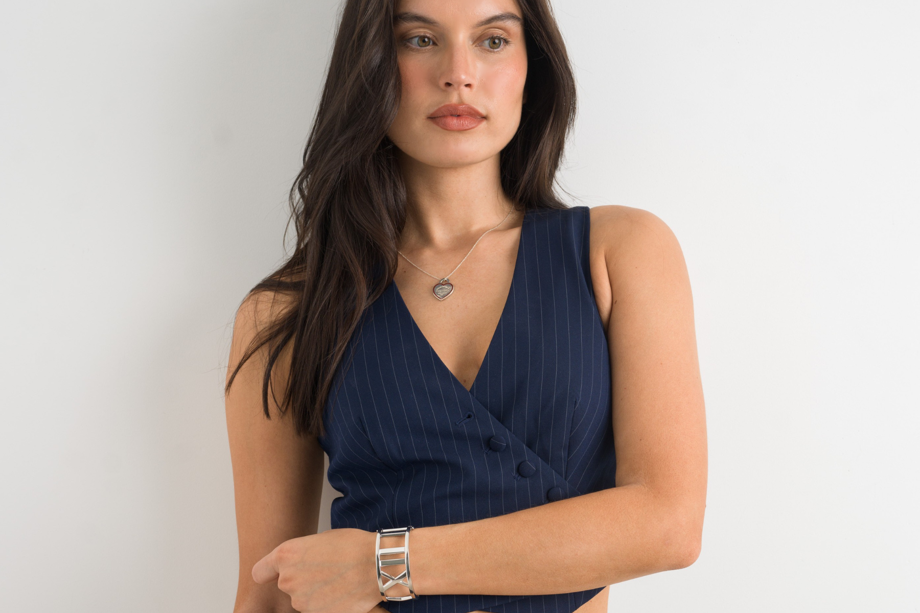 Model wearing silver Tiffany & Co jewelry